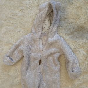Warm white baby onesie bodysuit